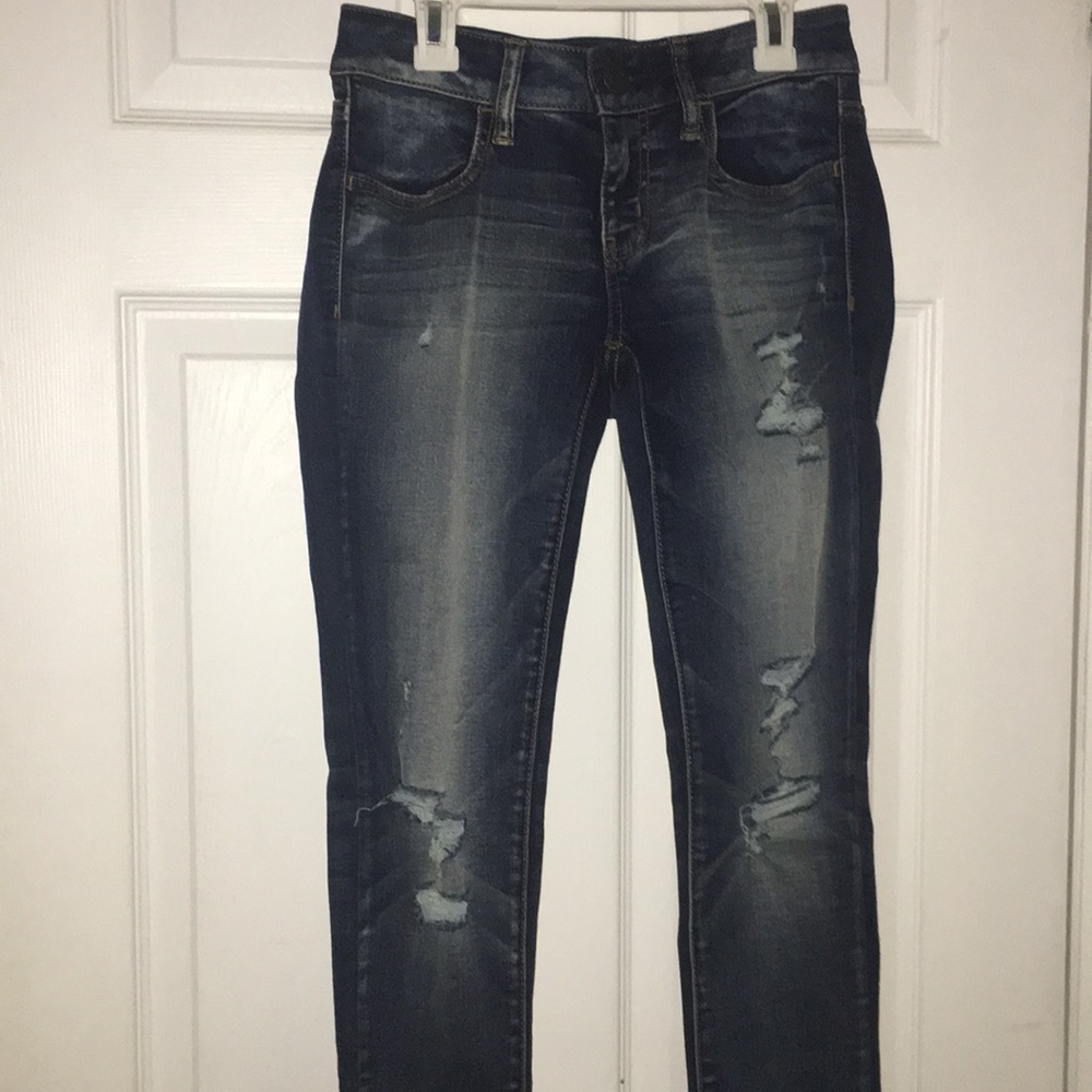 Dark wash jeans with rips